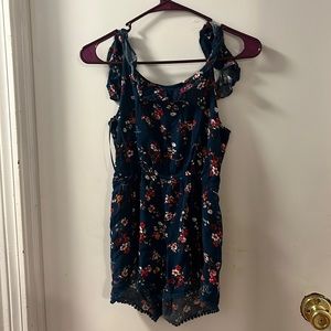Blue flowered romper, open sized, newly used, flowy, and size S